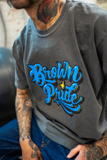 Load image into Gallery viewer, Brown Pride Freehand Royal Blue on Pepper Tee
