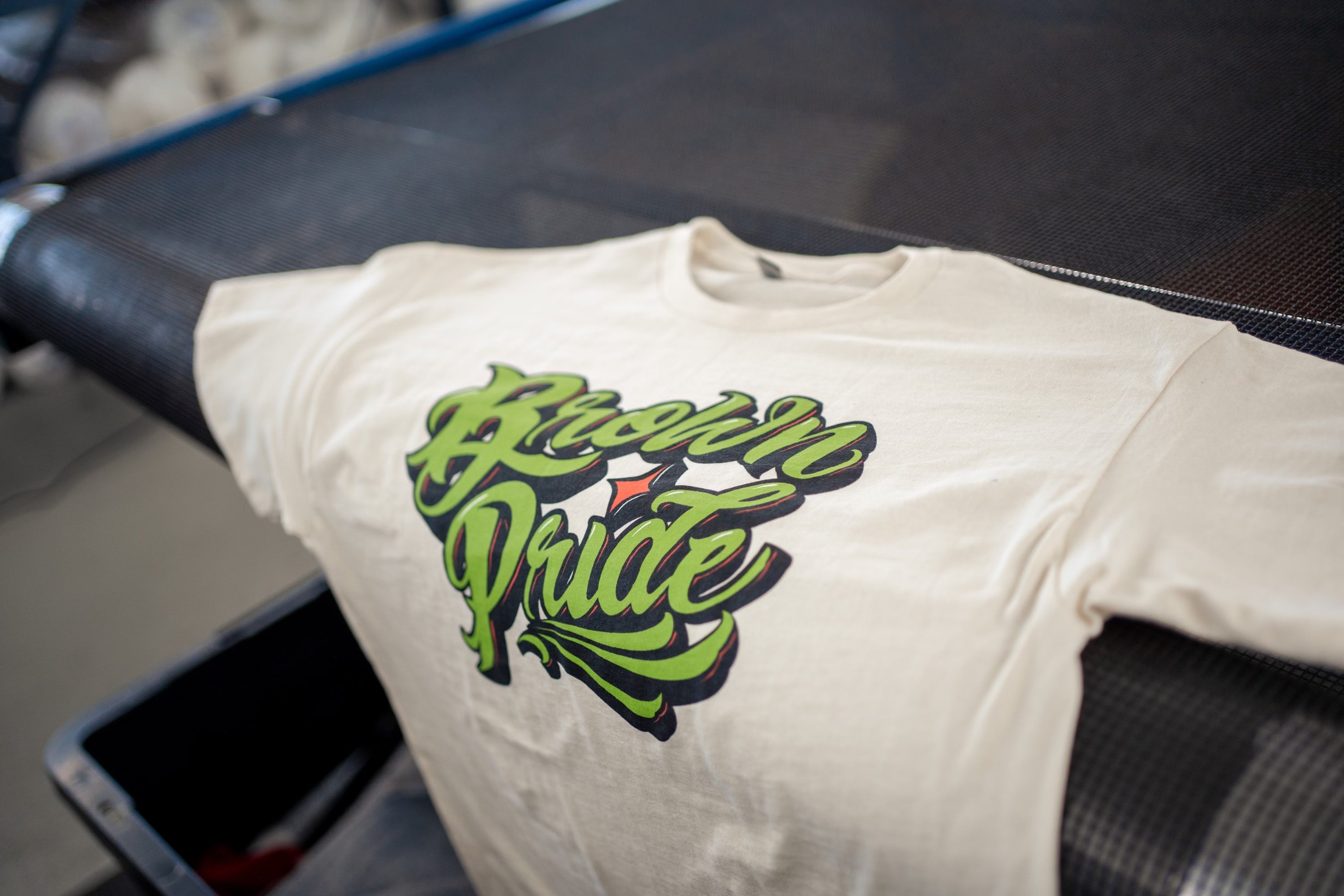 Brown Pride Freehand Green on Ivory Tee