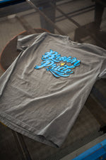 Load image into Gallery viewer, Brown Pride Freehand Royal Blue on Pepper Tee
